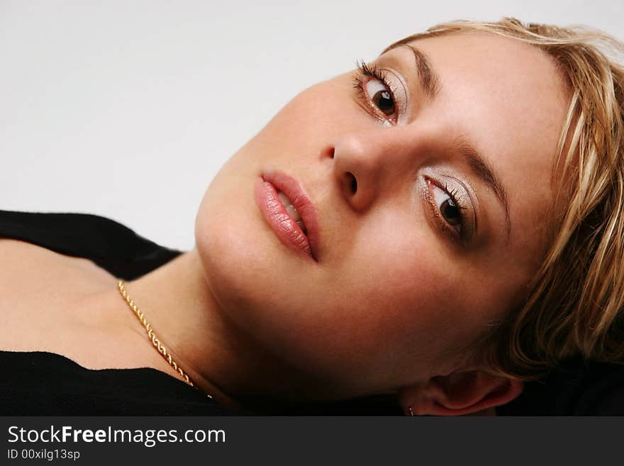 A portrait of a girl on a light background. A portrait of a girl on a light background.