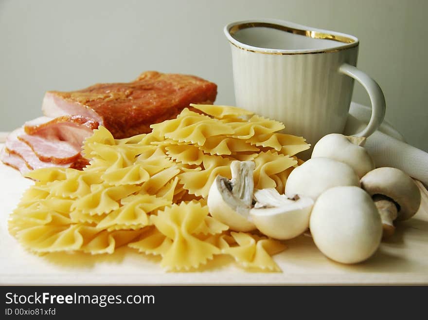 Ingredients for pasta on a wooden board. Ingredients for pasta on a wooden board.