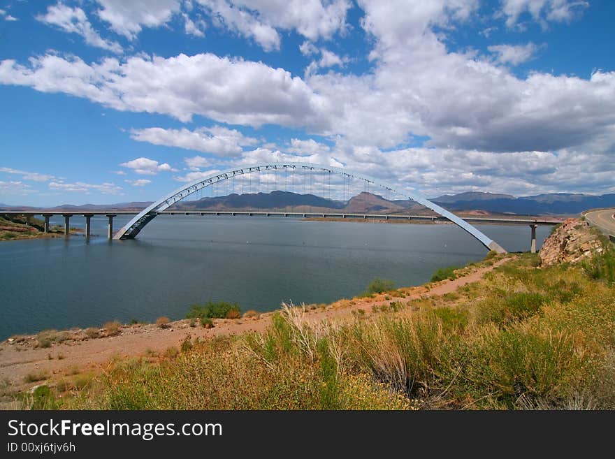 Arch Bridge with blue skys and puffy clouds. Arch Bridge with blue skys and puffy clouds