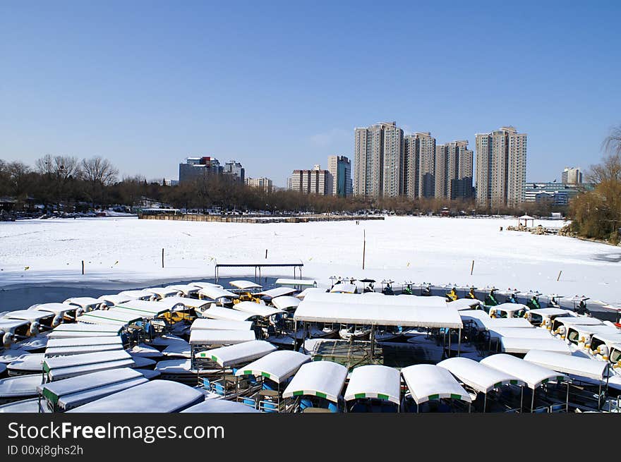 City with snow under blue sky in winter