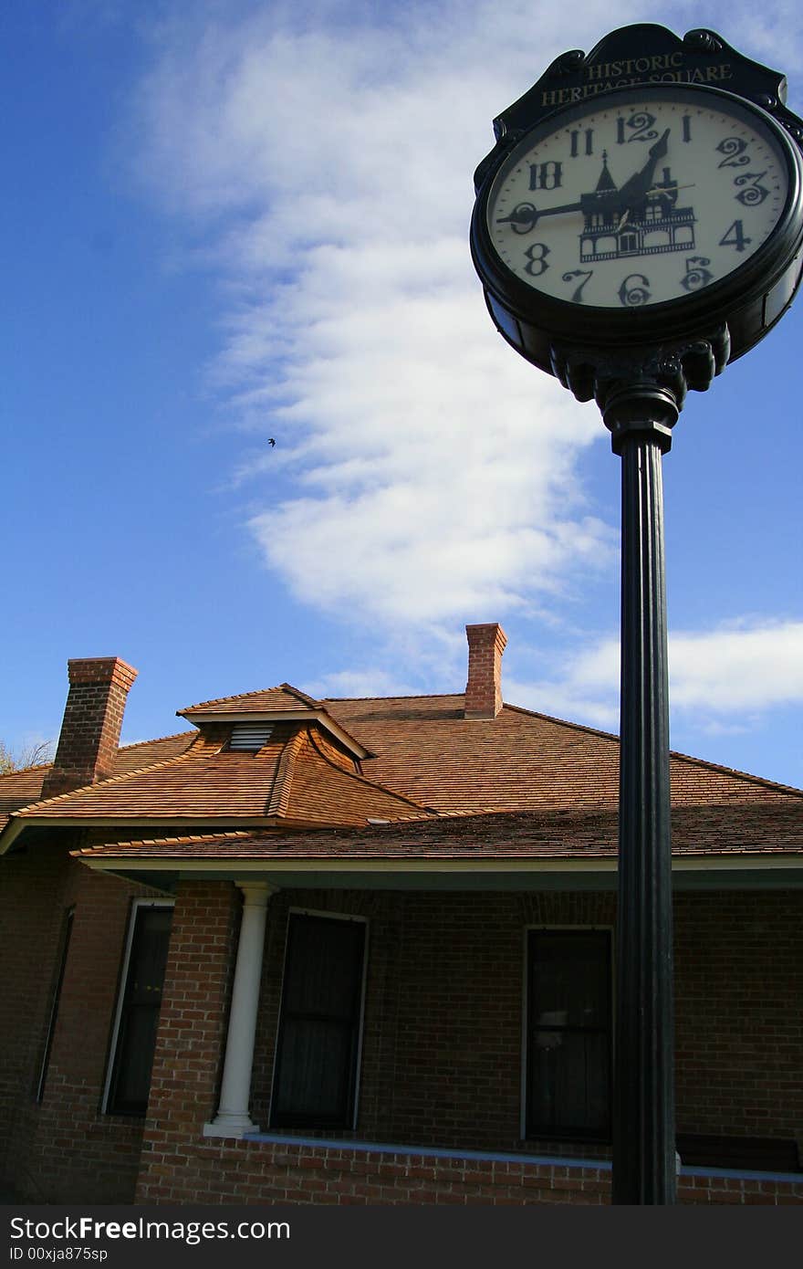 House, clock and cloud