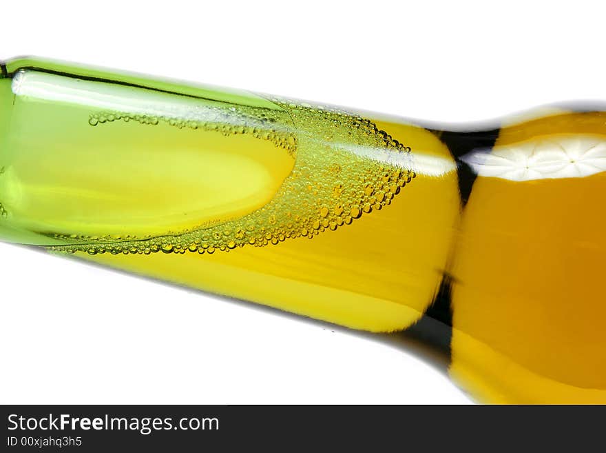 Bottle of beer closeup on white background