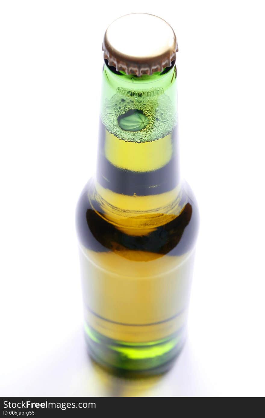 Bottle of beer closeup on white background