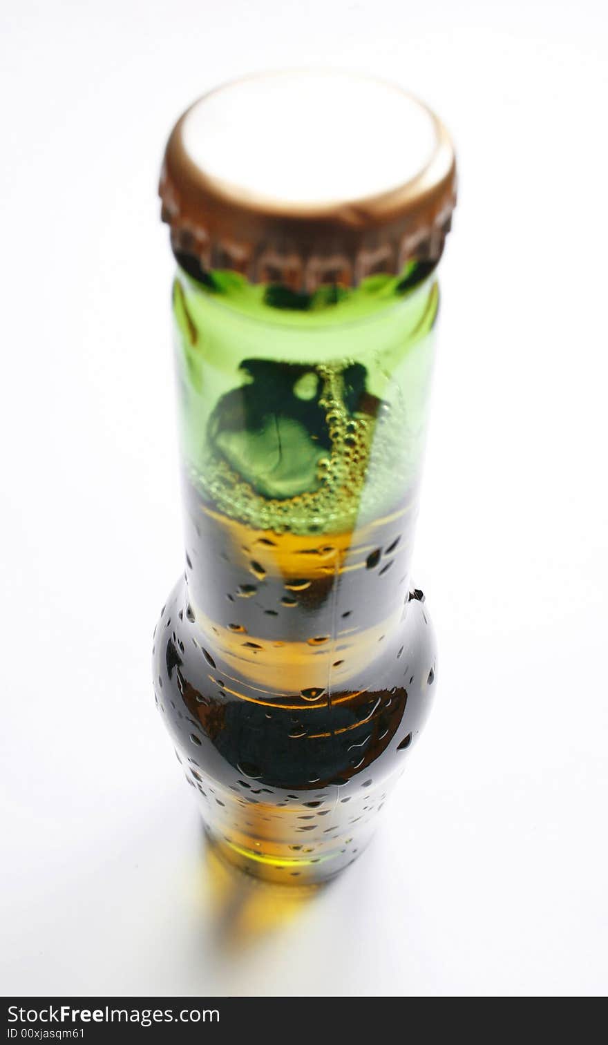 Wide angle shot of bottle of beer on white background