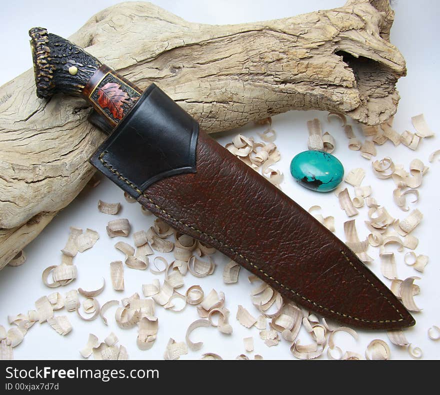 Knife in the scabbard on white background.