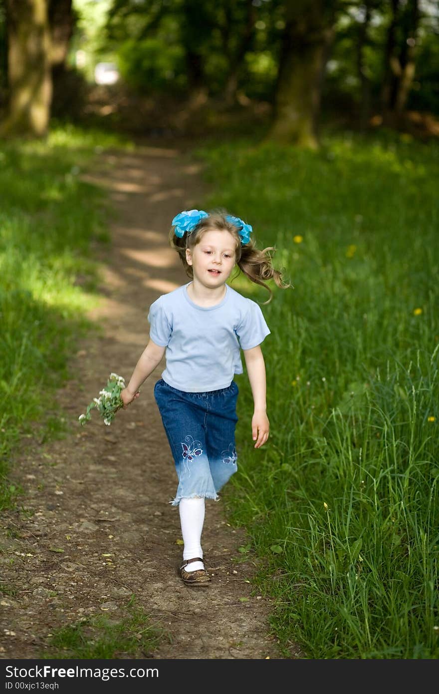 Girl running in a park. Girl running in a park