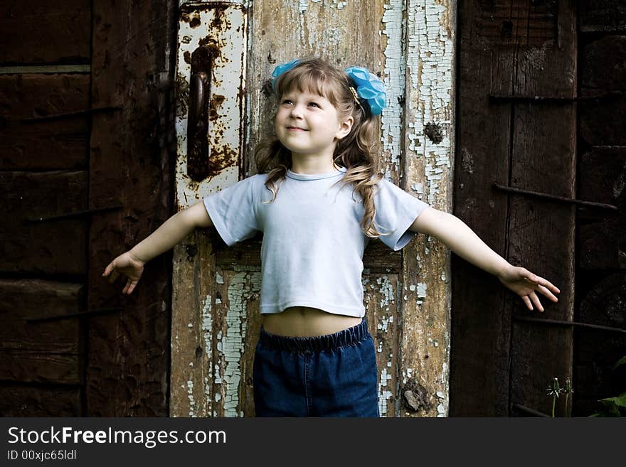 An image of girl at old door. An image of girl at old door