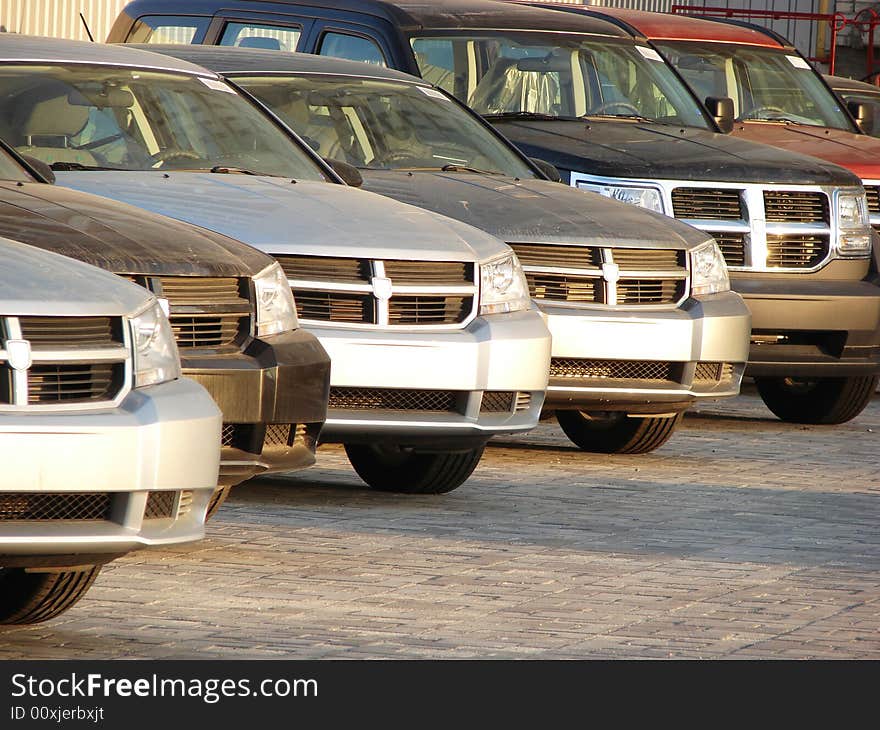 Modern style cars in a row outdoor evening. Modern style cars in a row outdoor evening