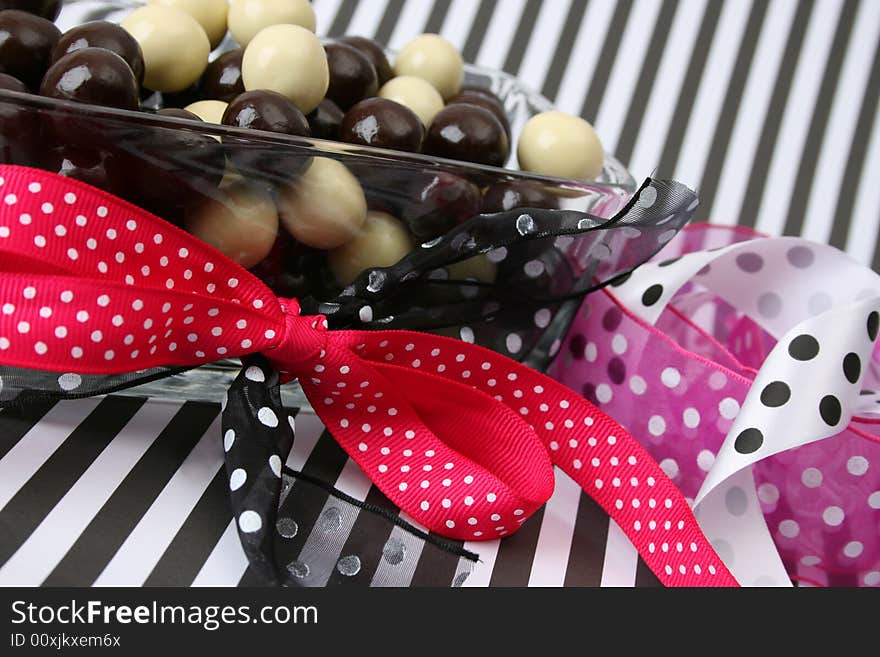 Vanilla and Dark Chocolate balls on a striped background