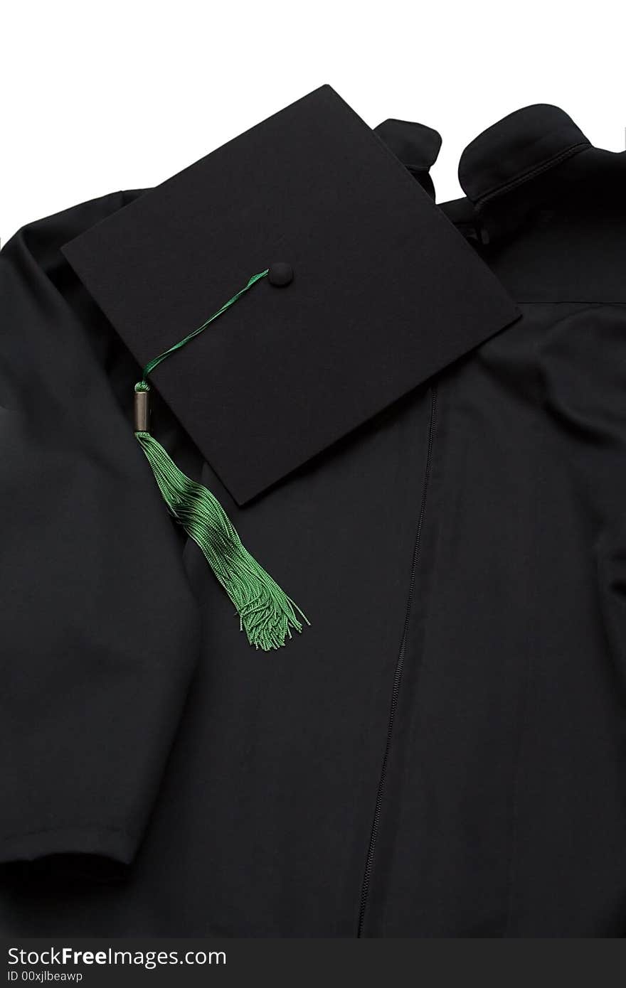 Graduation robe and cap on white background