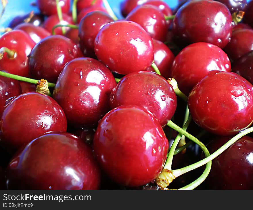 Juicy red cherries in a plate