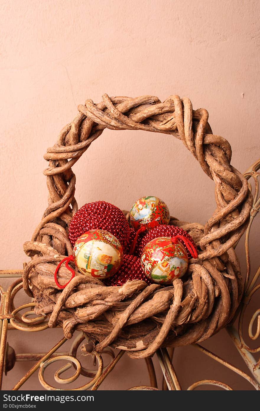 Woven Christmas basket on an old rustic bench. Woven Christmas basket on an old rustic bench