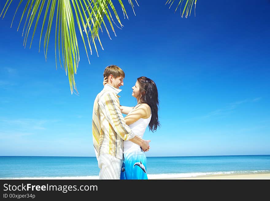 Portrait of attractive couple having date on the beach. Portrait of attractive couple having date on the beach