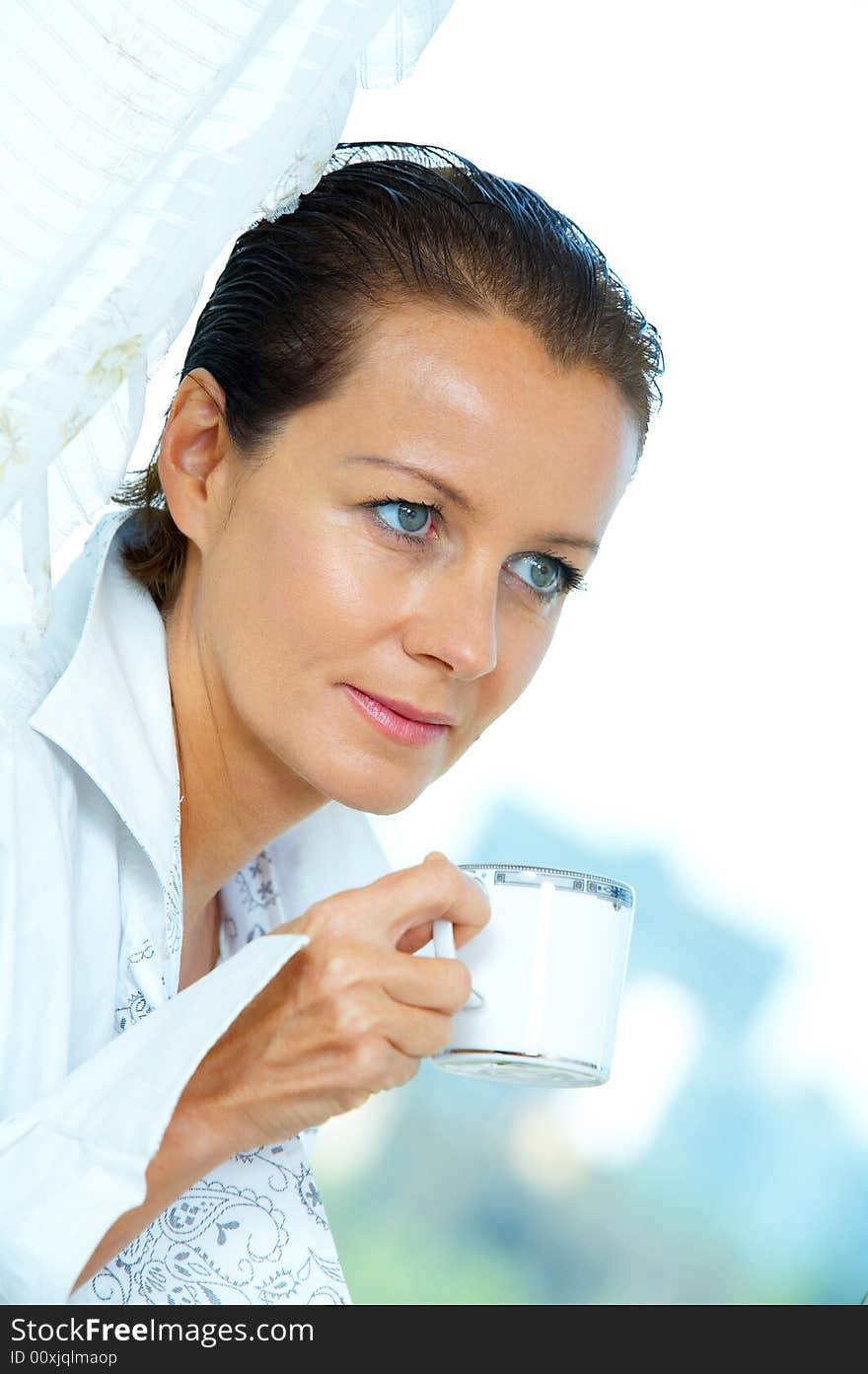 High key portrait of nice gorgeous woman drinking coffee