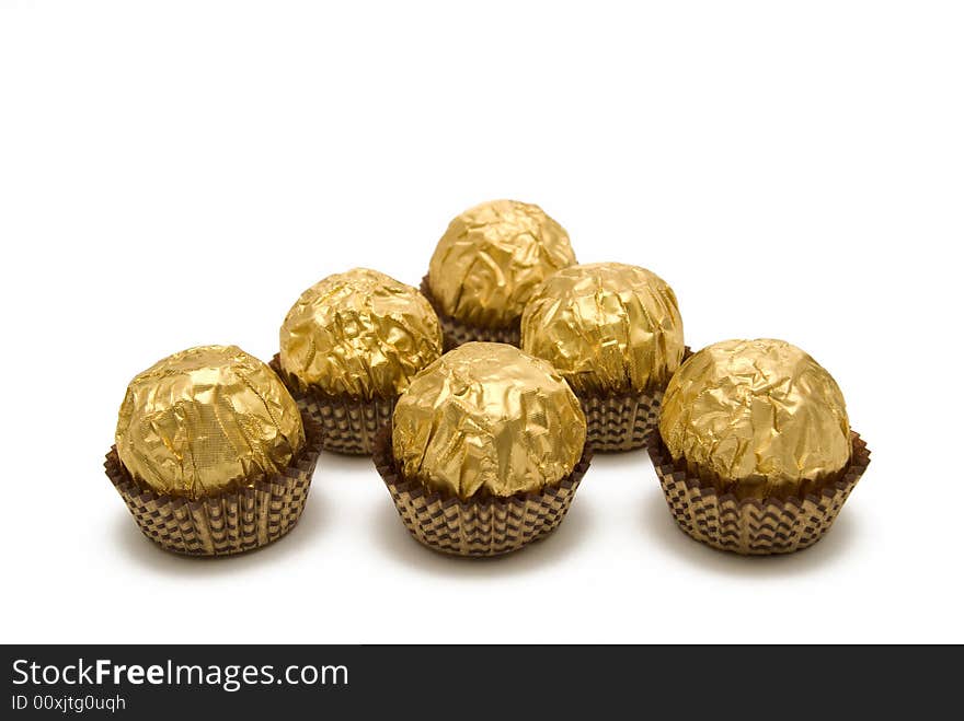 Chocolate candies are in the gold wrapping