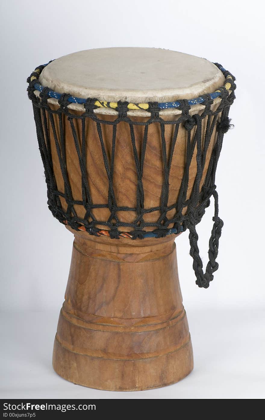 Manufacture in East Africa (IT is believed in Ghana) the Jemba drum is a traditional african musical instrument.. It is made of carved wood a hyde (in this case pig) drum skin and tensioned with chord.