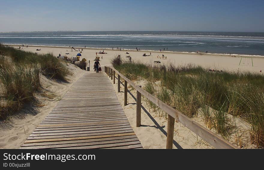 Beach with a wooden path. Beach with a wooden path