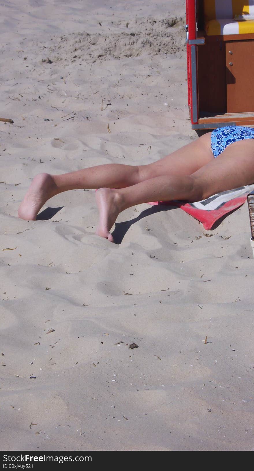 Taking a sun bath at the beach. Taking a sun bath at the beach