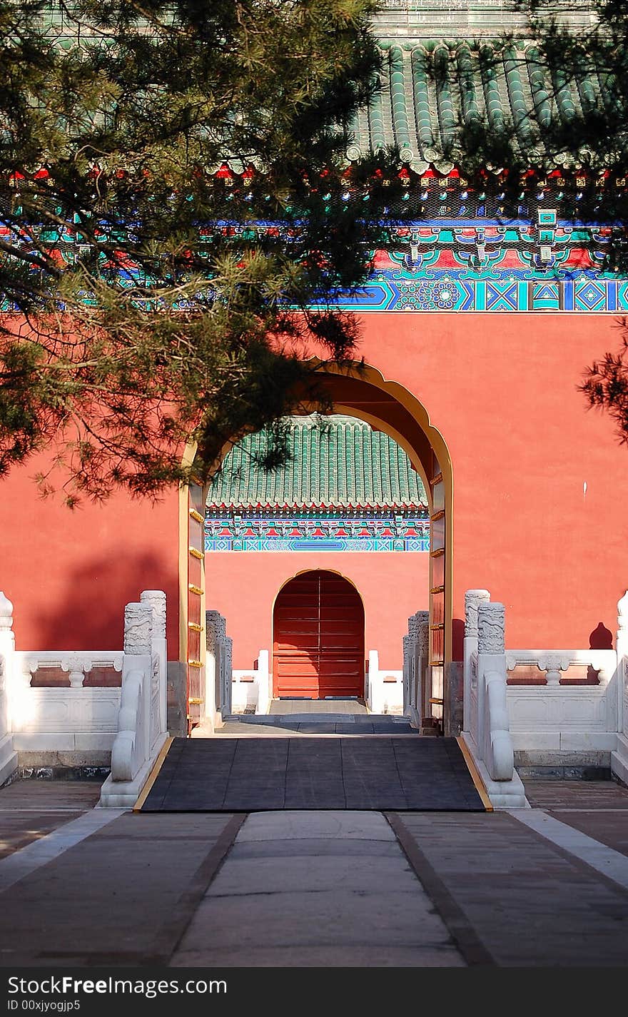 Traditional chinese red doors with beautiful decorations, shot at Temple of heaven park in Beijing China. Traditional chinese red doors with beautiful decorations, shot at Temple of heaven park in Beijing China.