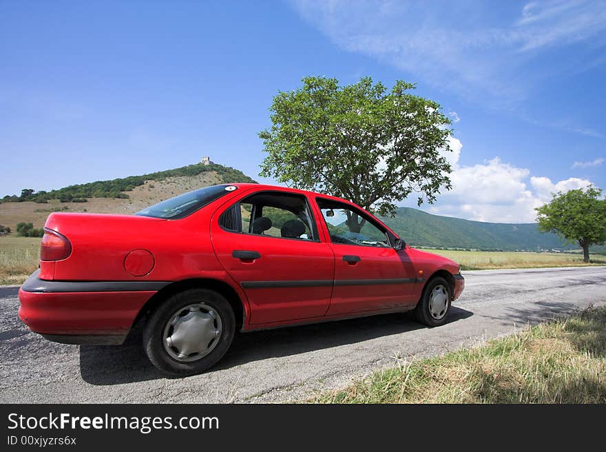 Beautiful weather 3. - beautiful day. Yellow field with red car