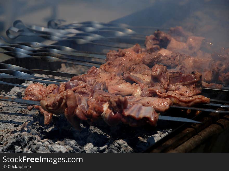 BBQ in traditional asian style cooking on coal with smoke. BBQ in traditional asian style cooking on coal with smoke