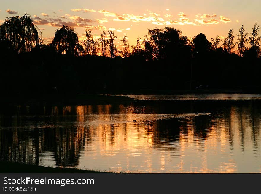 Black and Orange sunset at a lake. Black and Orange sunset at a lake