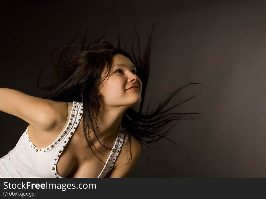 Attractive girl shaking her head isolated in studio