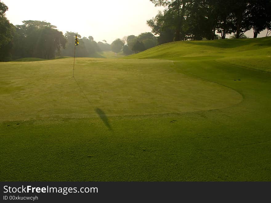 Fairway and green seen in the early morning light. Fairway and green seen in the early morning light