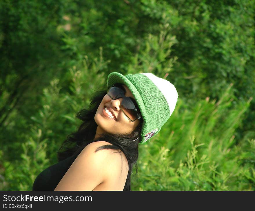 An Indian Model posing, during an outdoor shoot in the forest. An Indian Model posing, during an outdoor shoot in the forest