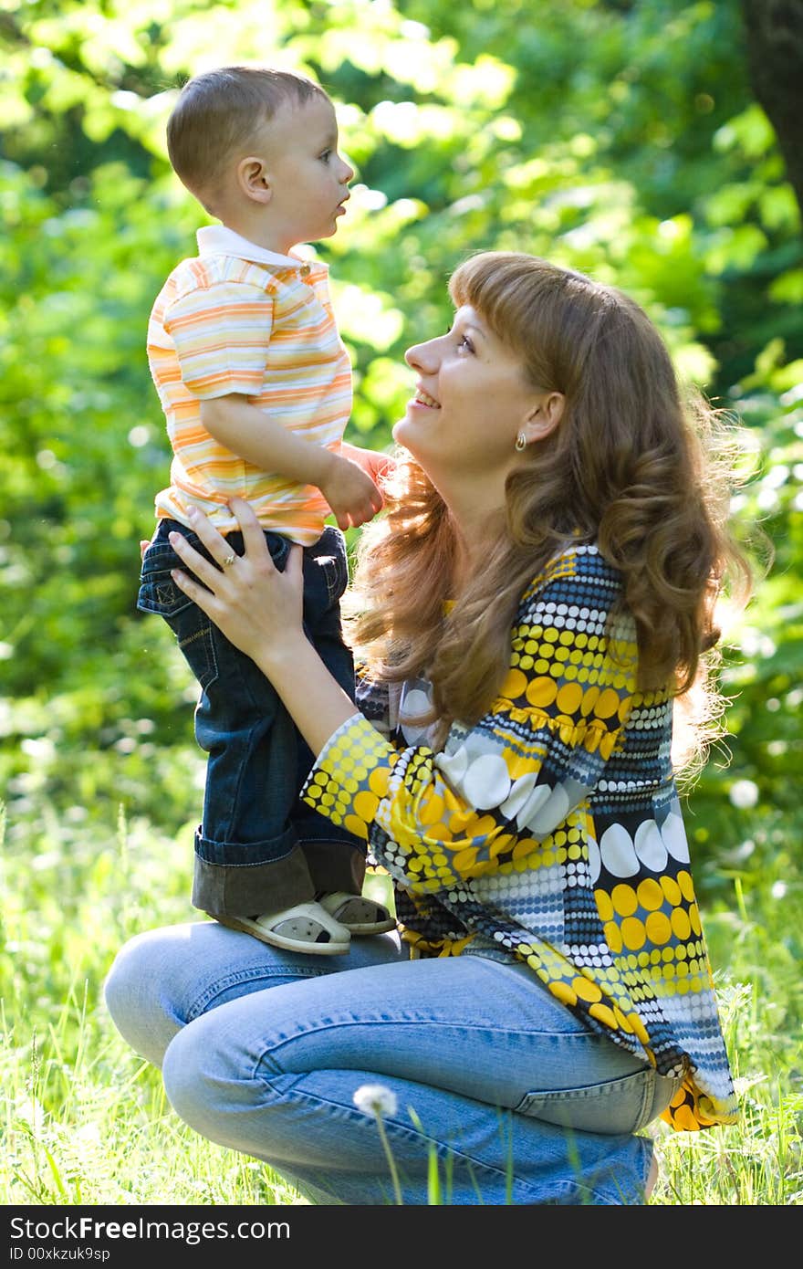 Mother and child outdoors, together and happy