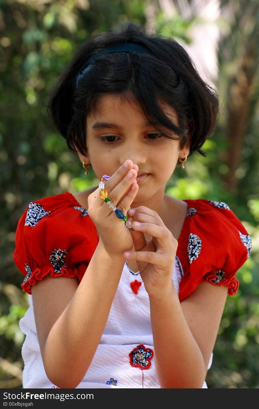 A girl wearing the bracelet.