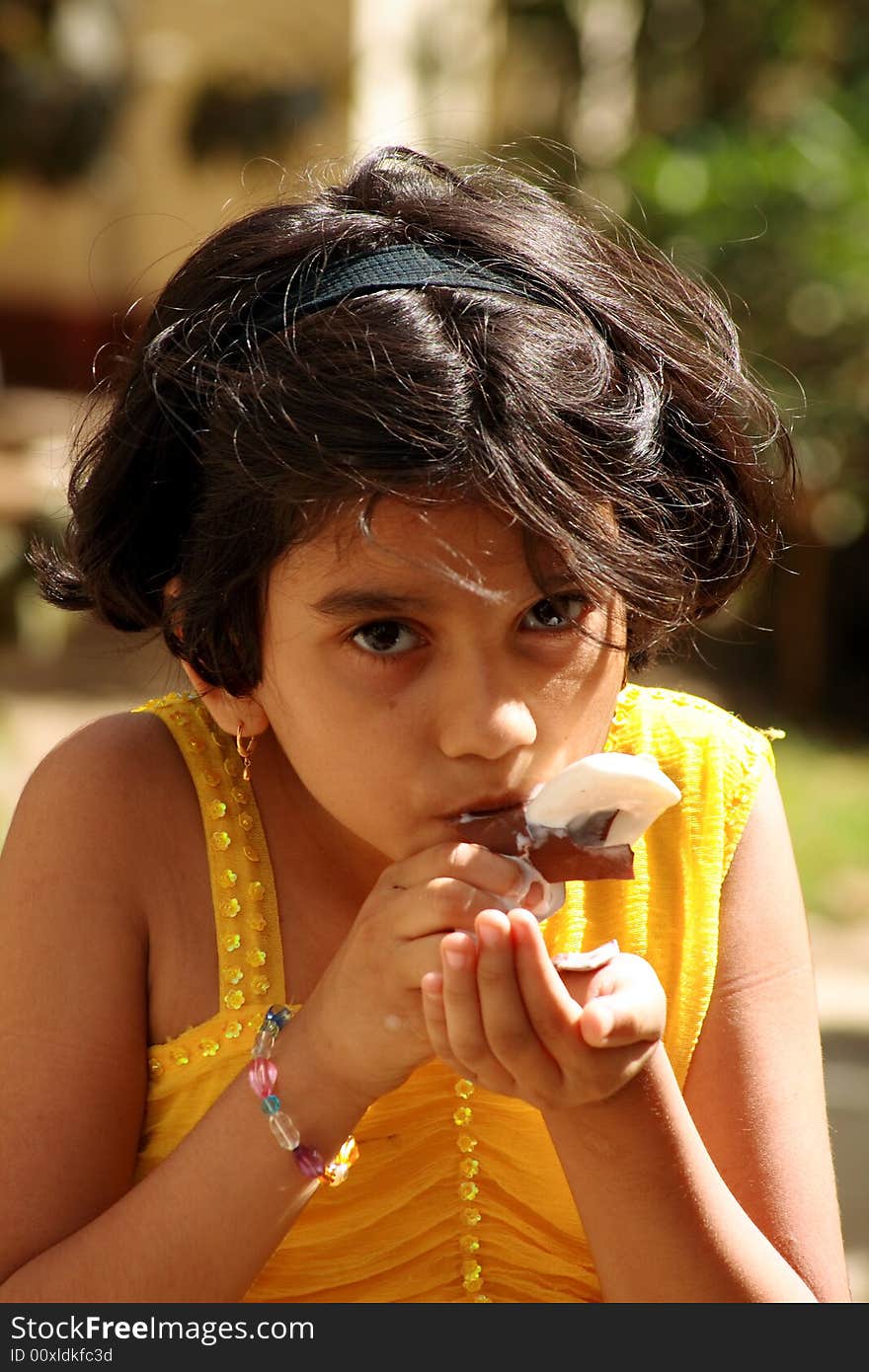 A girl very fond of eating ice-cream. A girl very fond of eating ice-cream.