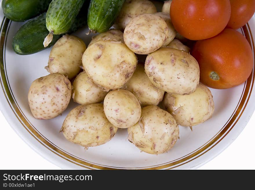 Potato and tomatoes on a white background