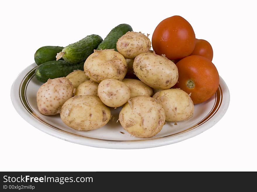 Potato and tomatoes on a white background. Potato and tomatoes on a white background