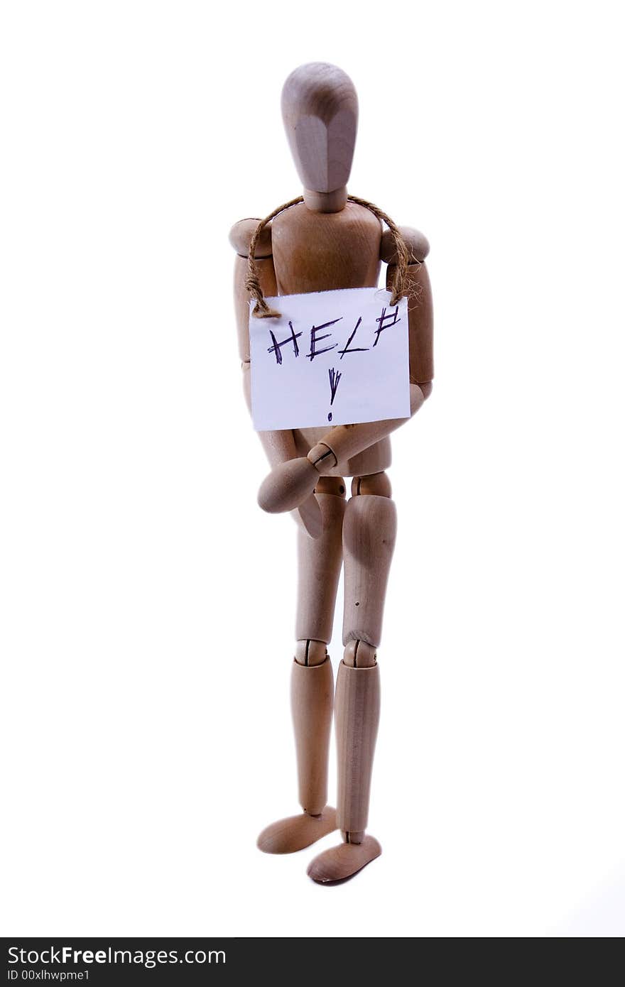 A wooden art mannequin with a help sign around its neck. A wooden art mannequin with a help sign around its neck.