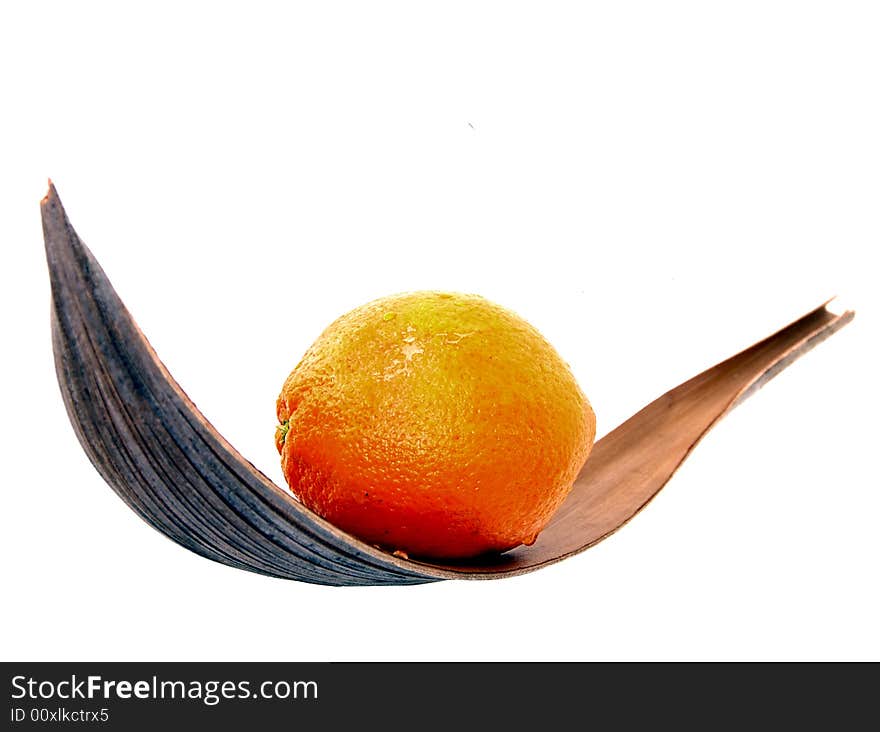 Orange on a leaf of coconut