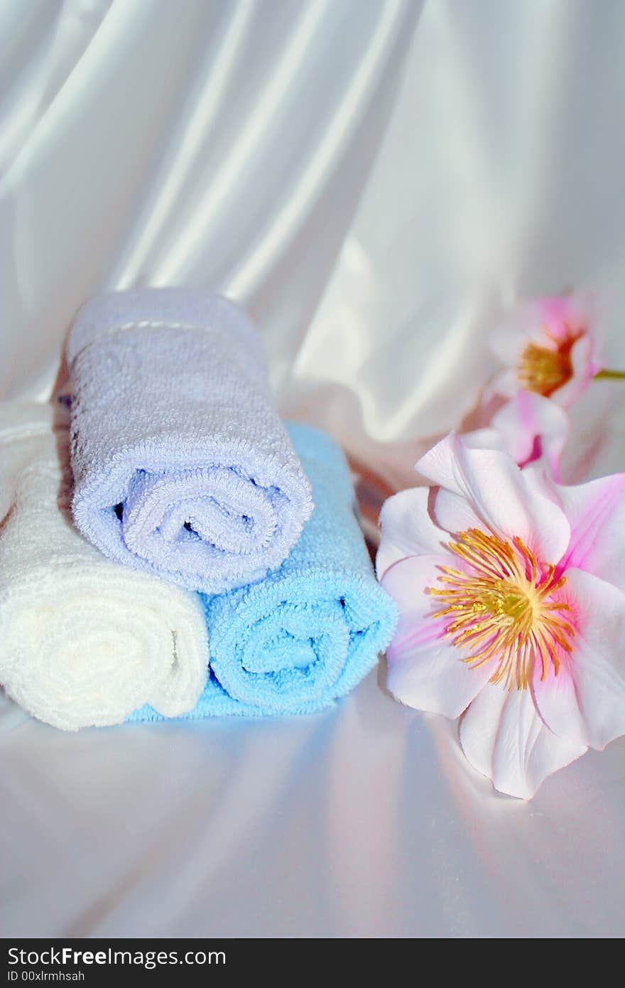 Towels and  flower in the bathroom