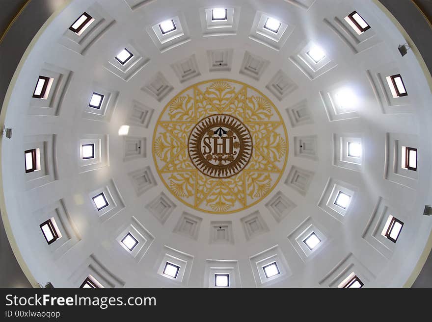 In the afternoon, the sun at the top of the church's roof, the sun light shine down from the roof's hole. . In the afternoon, the sun at the top of the church's roof, the sun light shine down from the roof's hole.