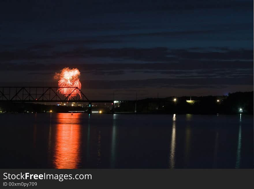 Firework, night city, bridge and reflection on water. Rostov-on-Don. Russia. Firework, night city, bridge and reflection on water. Rostov-on-Don. Russia