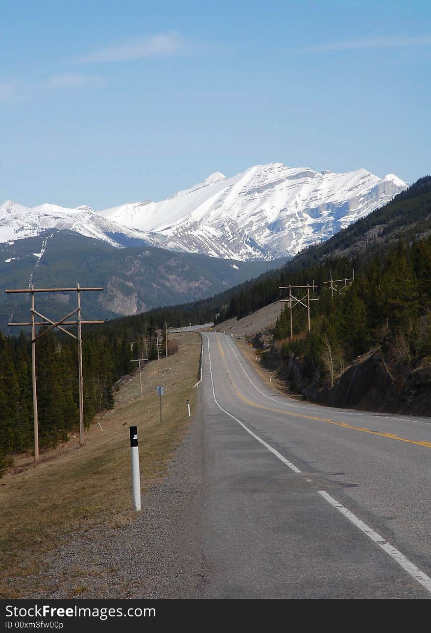 Landscape of spring rocky mountain and highway in kananaskis county, alberta, canada