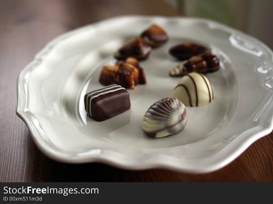 Chocolate pieces in various forms and sizes on a plate