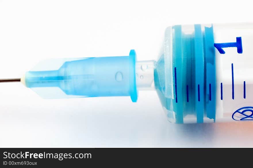 Macro shot of a syringe with soft focus and diffuse effect. Macro shot of a syringe with soft focus and diffuse effect