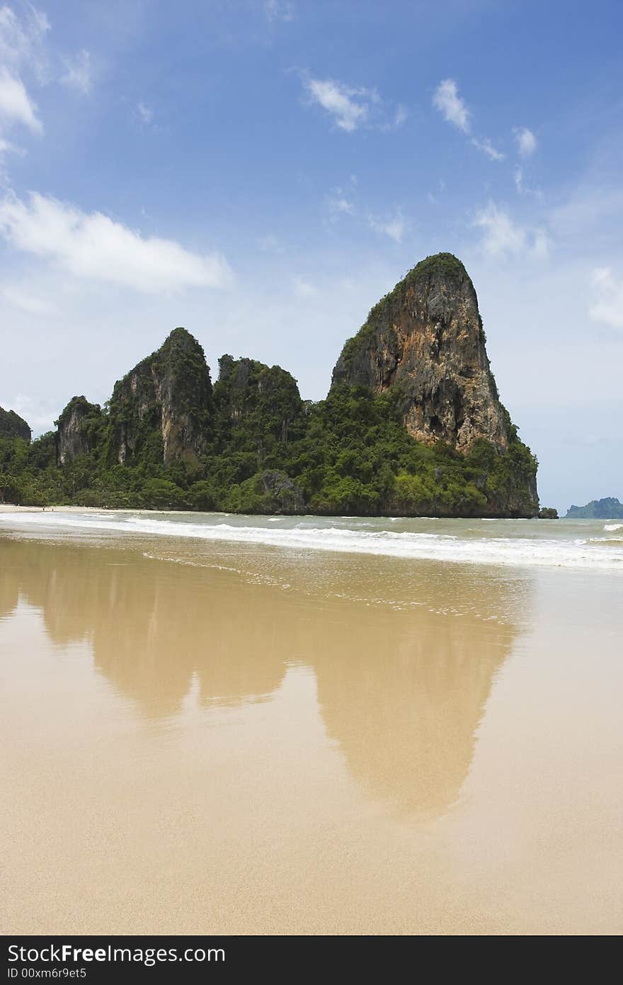 Railay beach, Southern Thailand. Limestone cliff rocks in background