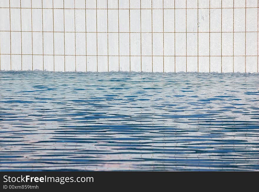 Detail of a white tiled swimming pool