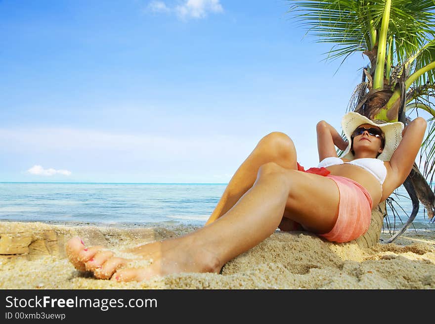 View of nice woman having fun on tropical beach. View of nice woman having fun on tropical beach