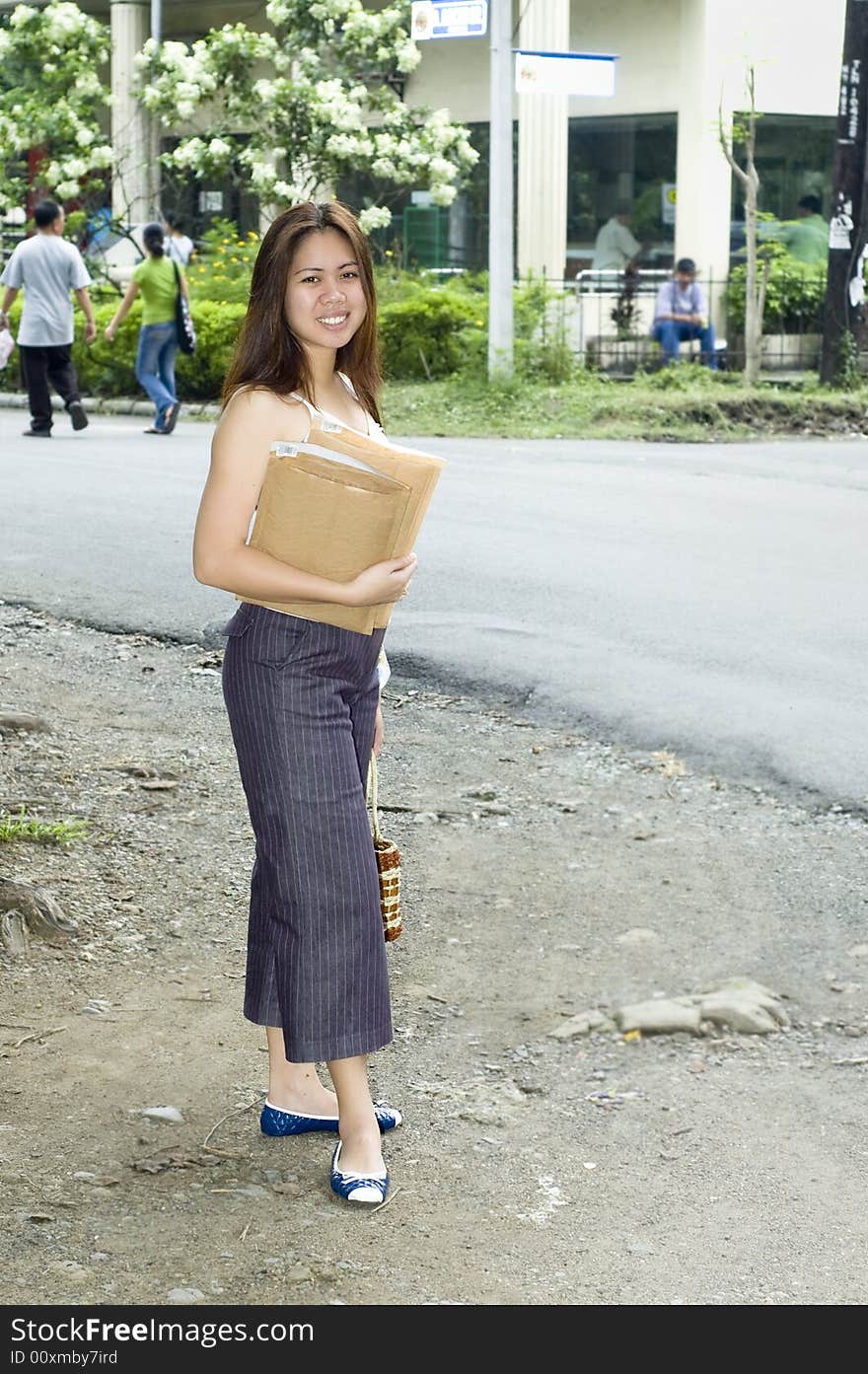 Woman on her way to the post to drop some mail. Part of series. Woman on her way to the post to drop some mail. Part of series.