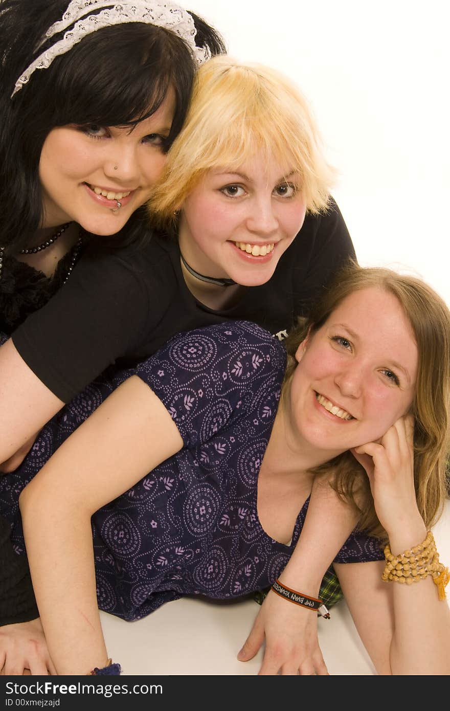 Three young girls on white background. Three young girls on white background