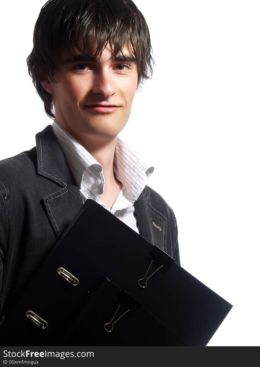 A portrait about an attractive young businessman who is smiling and he is holding some folders. He is wearing a white shirt and a stylish black suit. A portrait about an attractive young businessman who is smiling and he is holding some folders. He is wearing a white shirt and a stylish black suit.