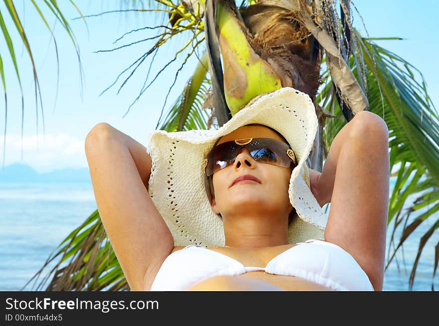 View of nice woman having fun on tropical beach. View of nice woman having fun on tropical beach