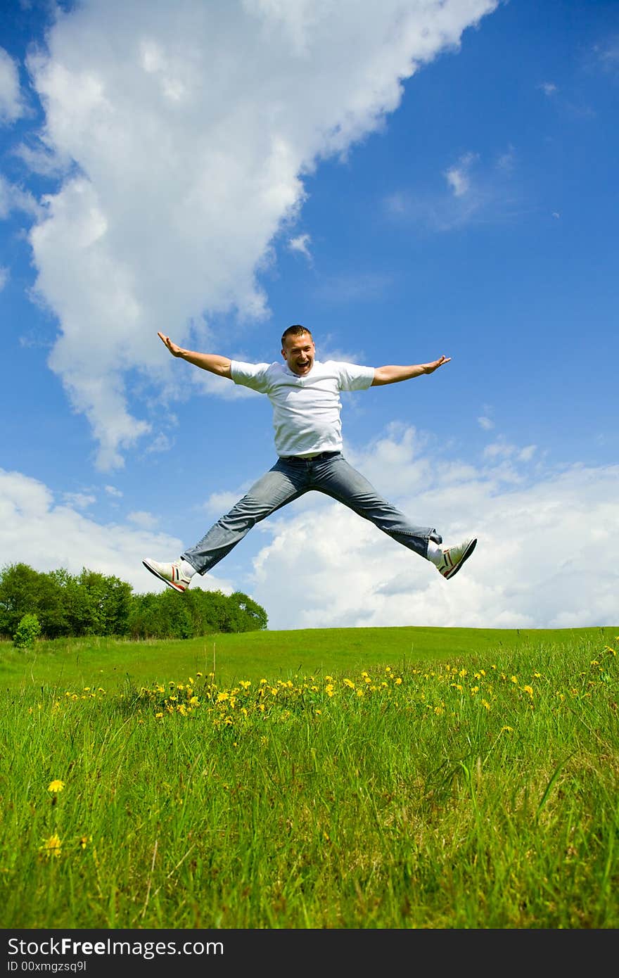 The man jumping on a lawn